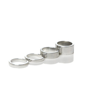 Silver spacers for custom steel bicycle frames for road, adventure, gravel, track/pista, and more.